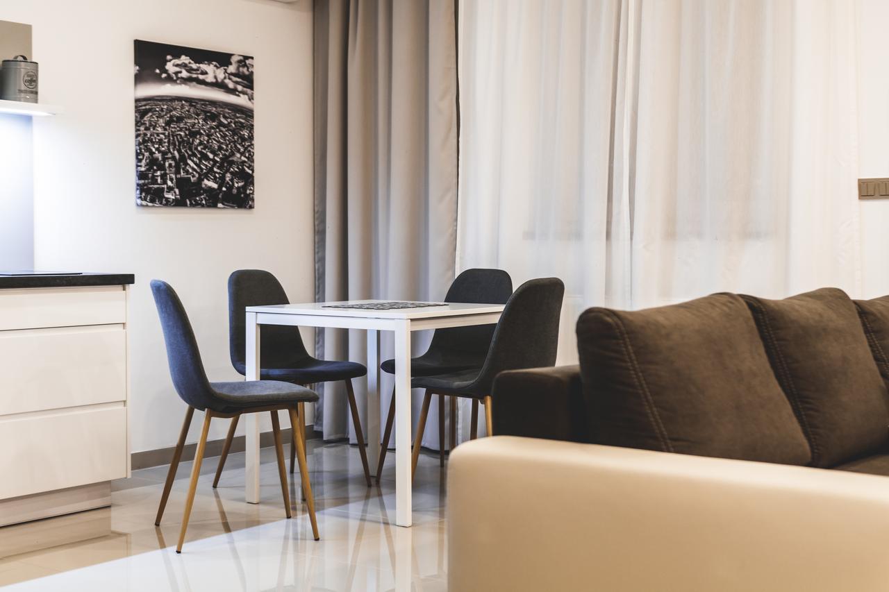 Silesia Residence Ostrava Exterior photo A living room with a dining table